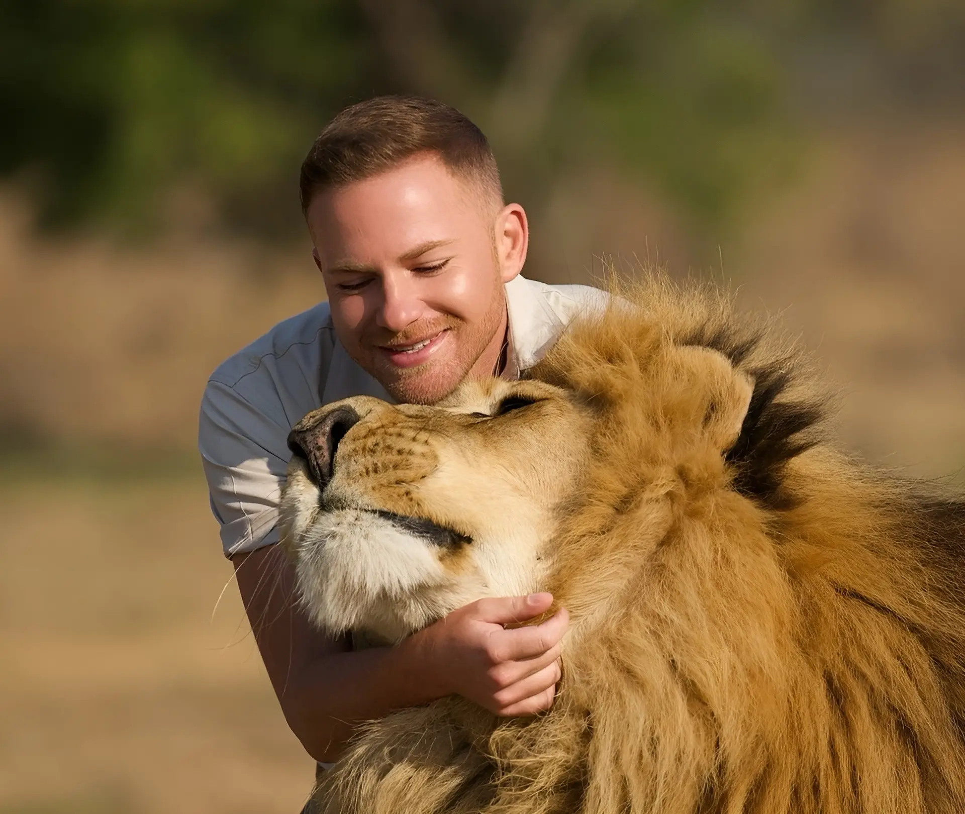 Shandor Larenty alongside a male lion in a photograph from his earlier wildlife-care work