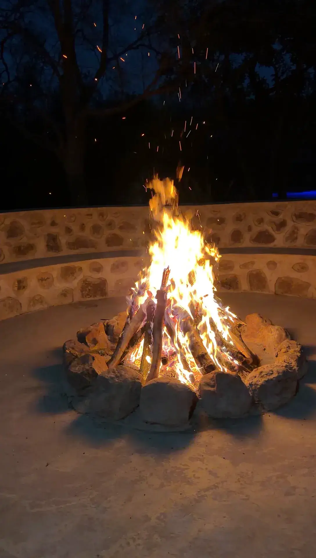 Evening fire in a stone boma at the sanctuary